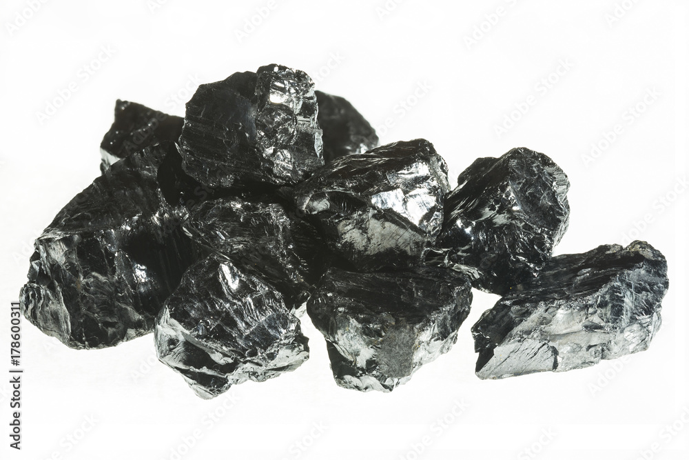 Black coal mine close-up with large depth of field. Anthracite coal bar isolated on white background