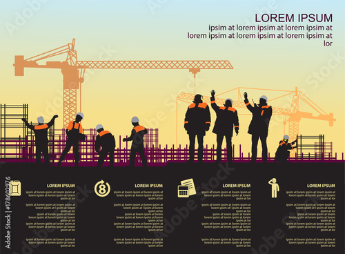 group of workers at the construction site of an industrial enterprise
