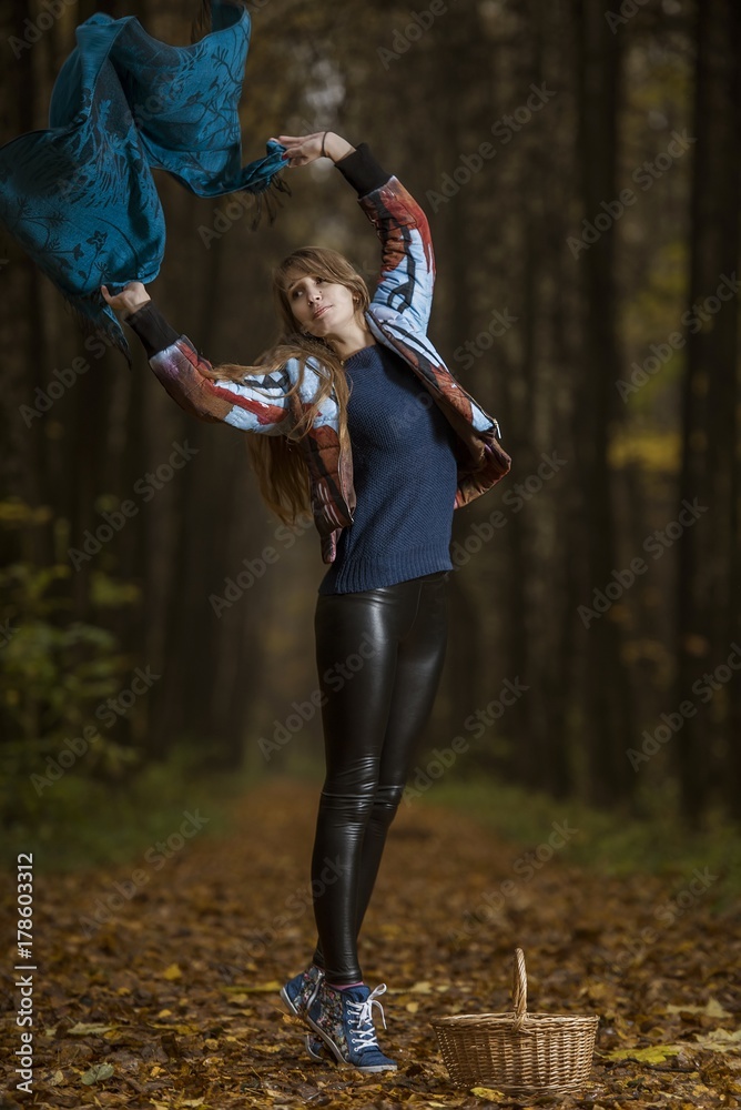 Beautiful girl in autumn forest.