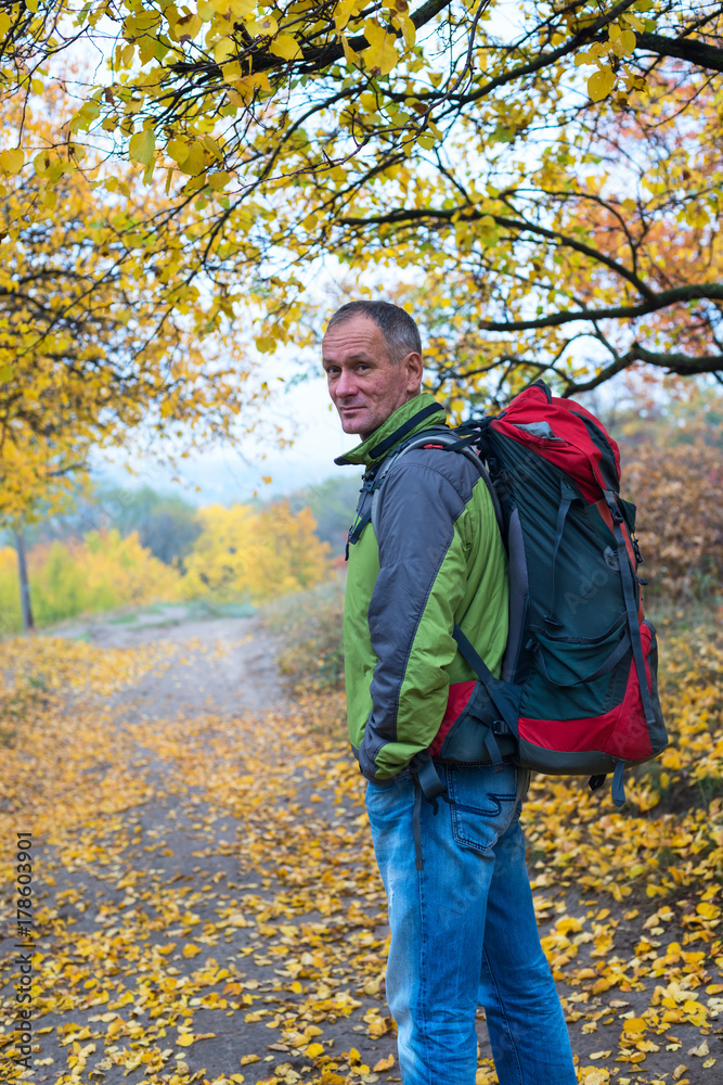 Happy traveler with a backpack Happy traveler with a backpack