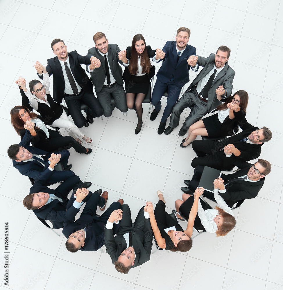 concept of team building .large successful business team sitting in a circle