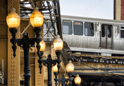 Street Lights and Train on elevated tracks within buildings at the Loop, Chicago City Center - Soft and Grainy Artistic Effect - Chicago, Illinois, USA photo