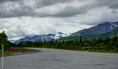 Empty street with mountain panoarama in Alaska United States of photo