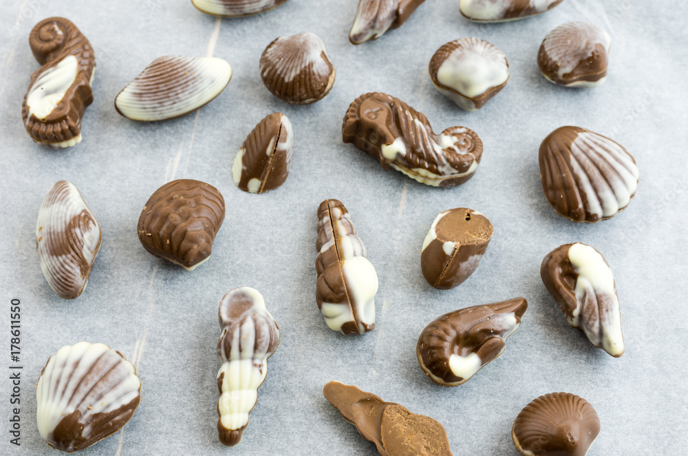 Sweets made from milk chocolate. Sweets in the form of sea shellfish.