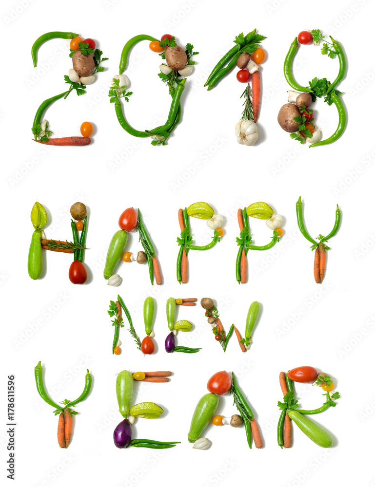 Number 2018 and text Happy new year written with vegetables, as a metaphor or concept for healthy food, living, diet, recipe. Isolated on white background. End of the year resolution Number 2018 and text Happy new year written with vegetables, as a metaphor or concept for healthy food, living, diet, recipe. Isolated on white background. End of the year resolution