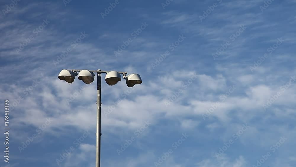 Light pole with blue sky and clouds Light pole with blue sky and clouds