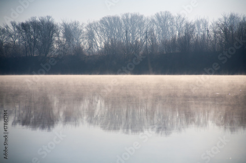 Morning on the river early morning reeds mist fog and water surface on the river © mironovm