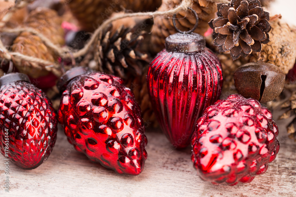 Christmas cone with red berries on a bokeh background. Christmas cone with red berries on a bokeh background.
