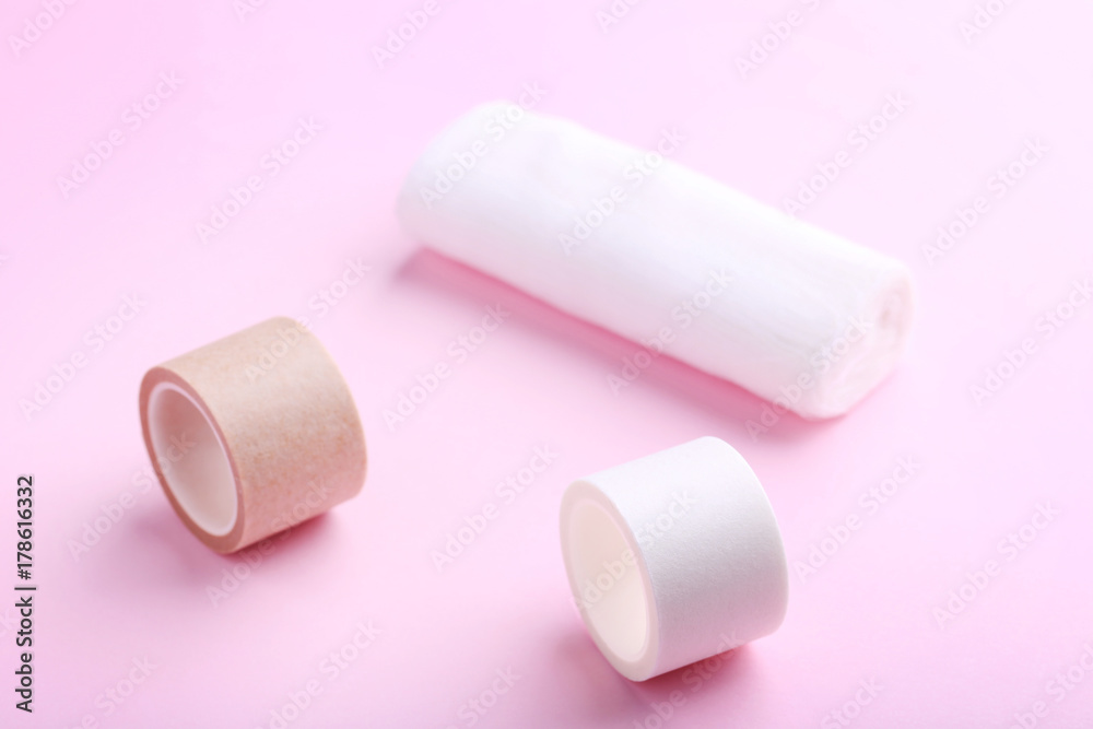 Medical plasters on pink background Medical plasters on pink background