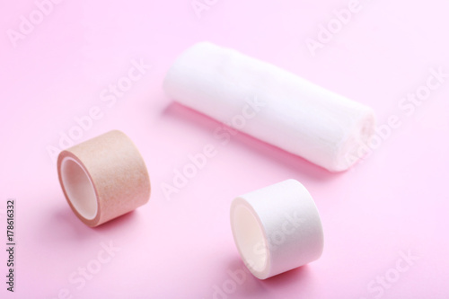 Medical plasters on pink background