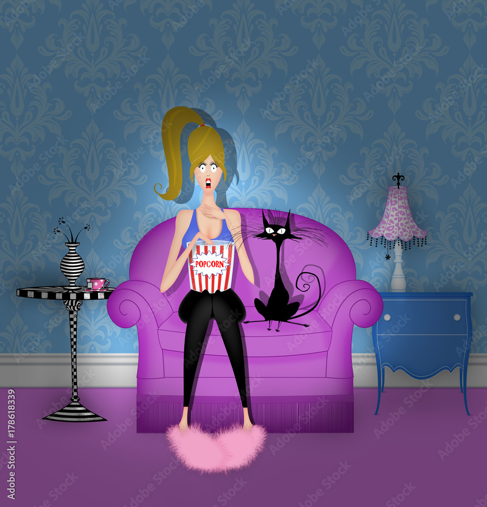 Fototapeta premium Cute Girl Watching a Scary Movie in the Dark