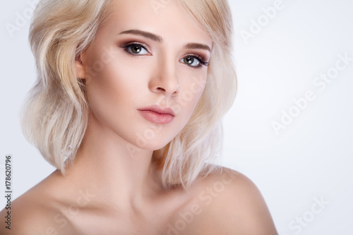 Beautiful Woman Face Portrait. Female Touching Skin Under Eyes