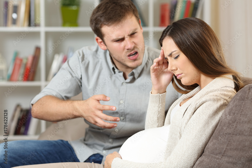 Sad pregnant woman fighting with her husband Sad pregnant woman fighting with her husband