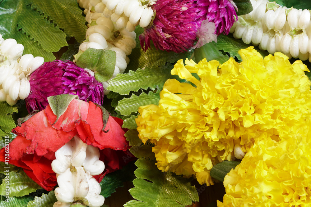 Malai Yellow, Red rose, white rak flower in round shape Malai Yellow, Red rose, white rak flower in round shape