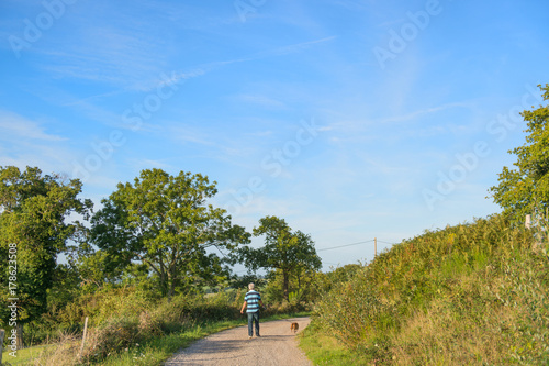 Man with dog in landscape