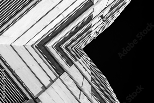 Abstract image of looking up at modern brick concrete building. Architecutural exterior detail of industrial office building. Industrail art and detail.