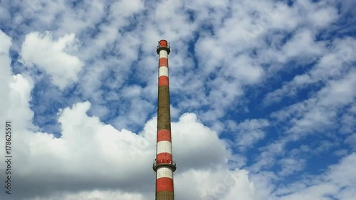 HDR video of industrial plant chimney without smoke, clouds passing by in background, 

vivid colors