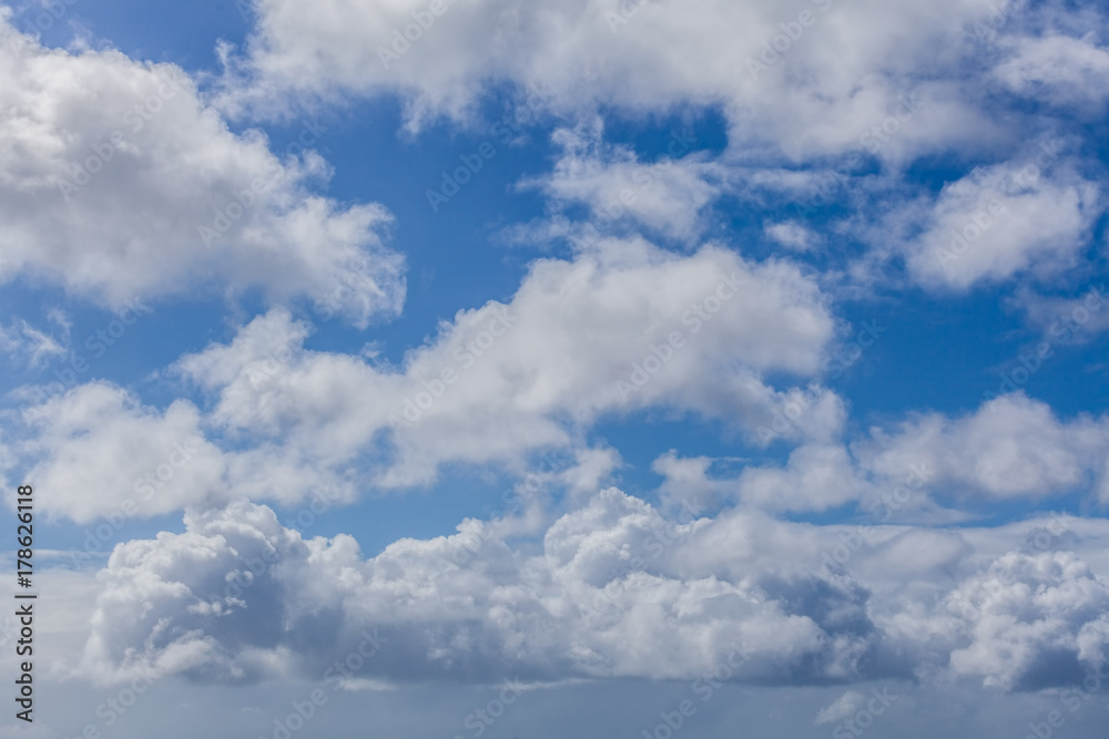 White fluffy clouds in a blue sky - beautiful cloudscape White fluffy clouds in a blue sky - beautiful cloudscape