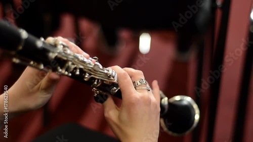 Woman playing Oboe. Classical music concert photo