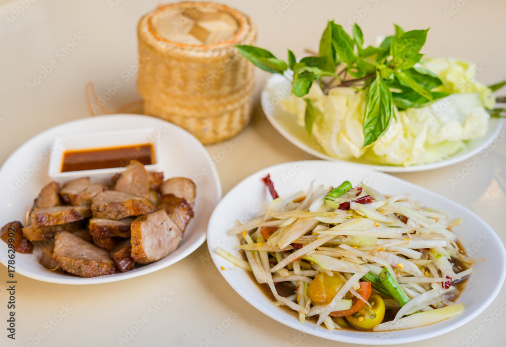 Papaya salad with pickled fish sauce, This dish eat with sticky rice, grilled pork and fresh vegetable, Thai food Papaya salad with pickled fish sauce, This dish eat with sticky rice, grilled pork and fresh vegetable, Thai food