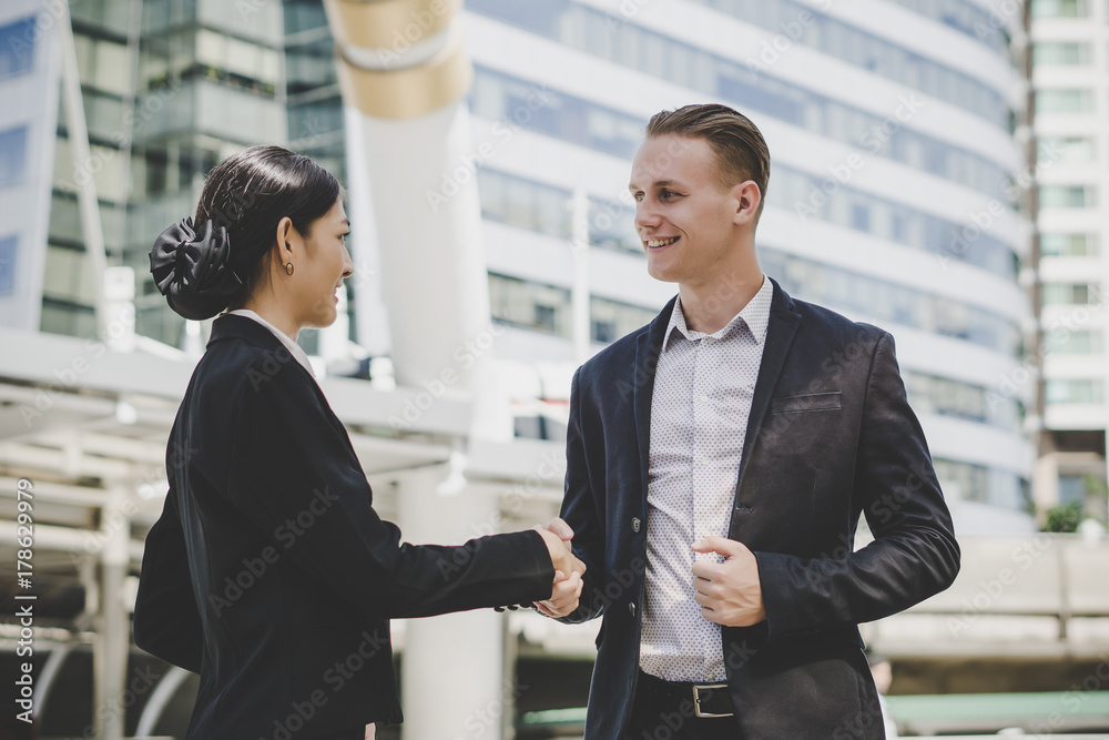 Business people shaking hands, finishing up meeting deals. Business concept. Business people shaking hands, finishing up meeting deals. Business concept.
