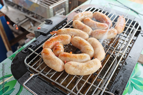 native grilled sausage with sour flavour in the north of thailand. photo