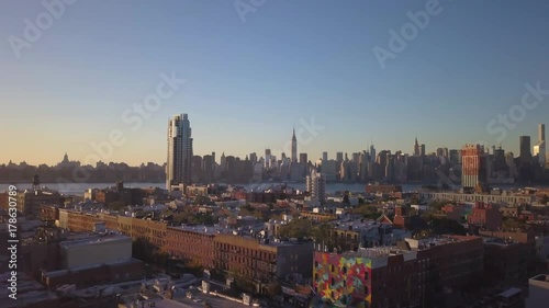 shot of Manhattan skyline flying backward revealing Greenpoint Brooklyn church photo
