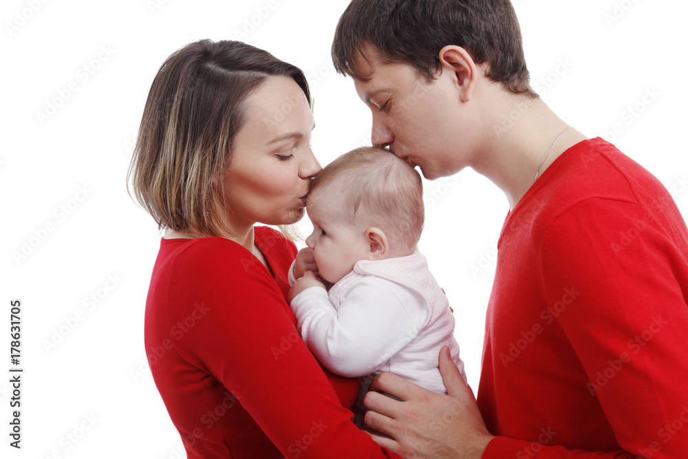 Close up of parents cuddling adorable baby. Image isolated against white background Close up of parents cuddling adorable baby. Image isolated against white background
