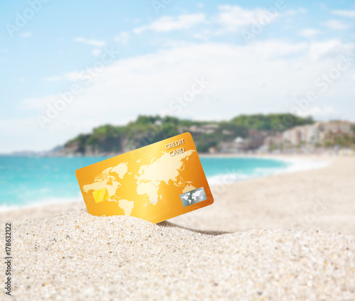 Fotografie Credit card on tropical beach