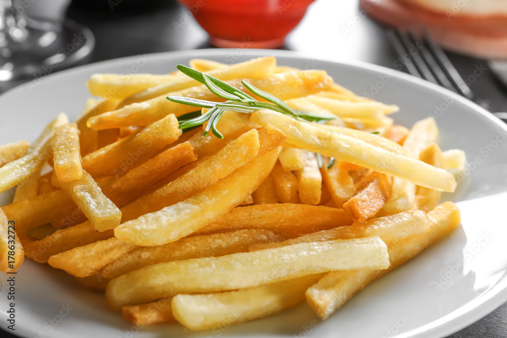 Plate with yummy french fries, closeup Plate with yummy french fries, closeup