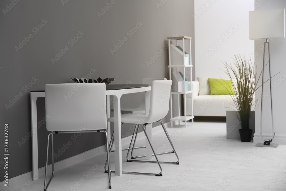 Modern room interior with white chairs and table Modern room interior with white chairs and table