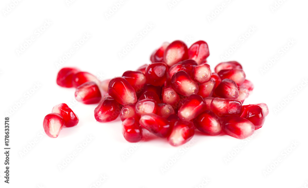 Fresh seeds of pomegranate isolated on white background. Macro. Fresh seeds of pomegranate isolated on white background. Macro.
