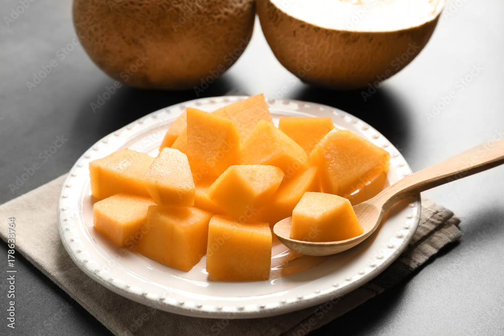 Plate with sliced melon on table, closeup Plate with sliced melon on table, closeup