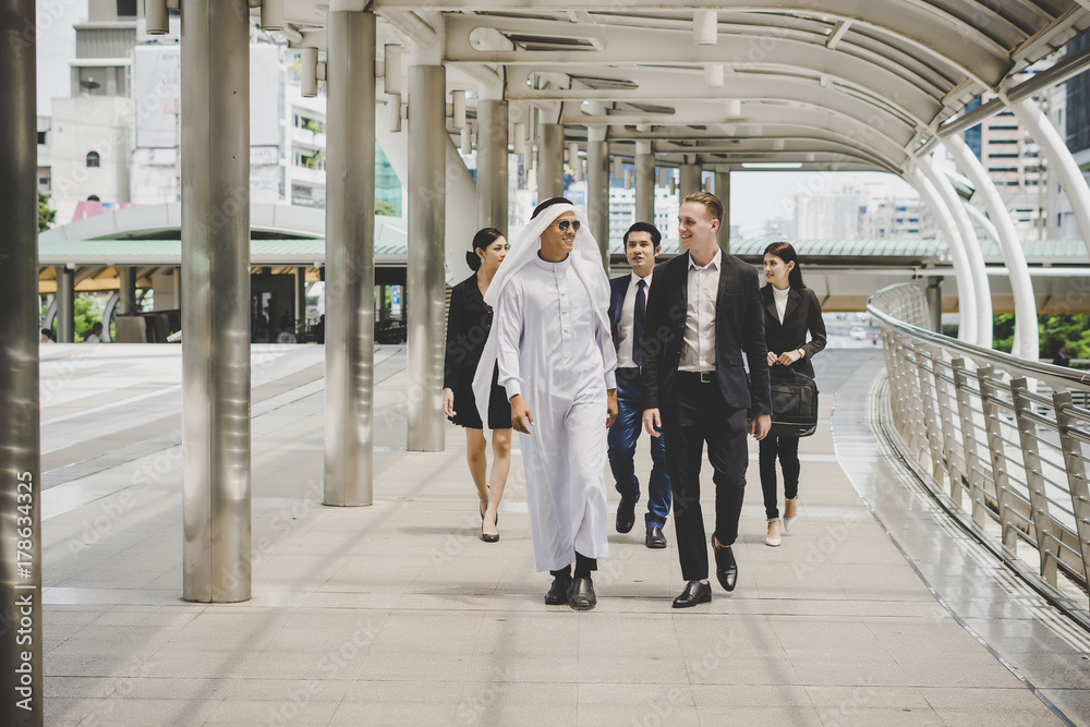 Fototapeta premium Business partners team walking down and discussing work.