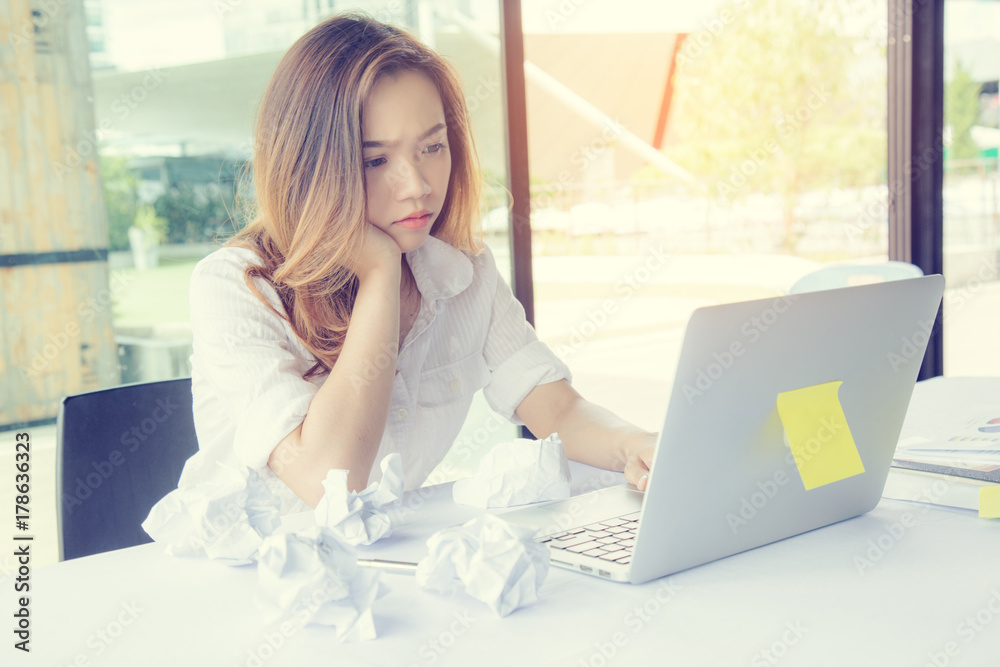 Asia girl use laptop emotion edgy or busy or anxiety due to work or education. Asia girl use laptop emotion edgy or busy or anxiety due to work or education.