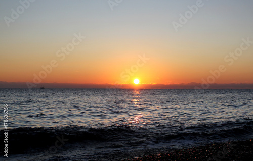 Photo of a bright sea sunset