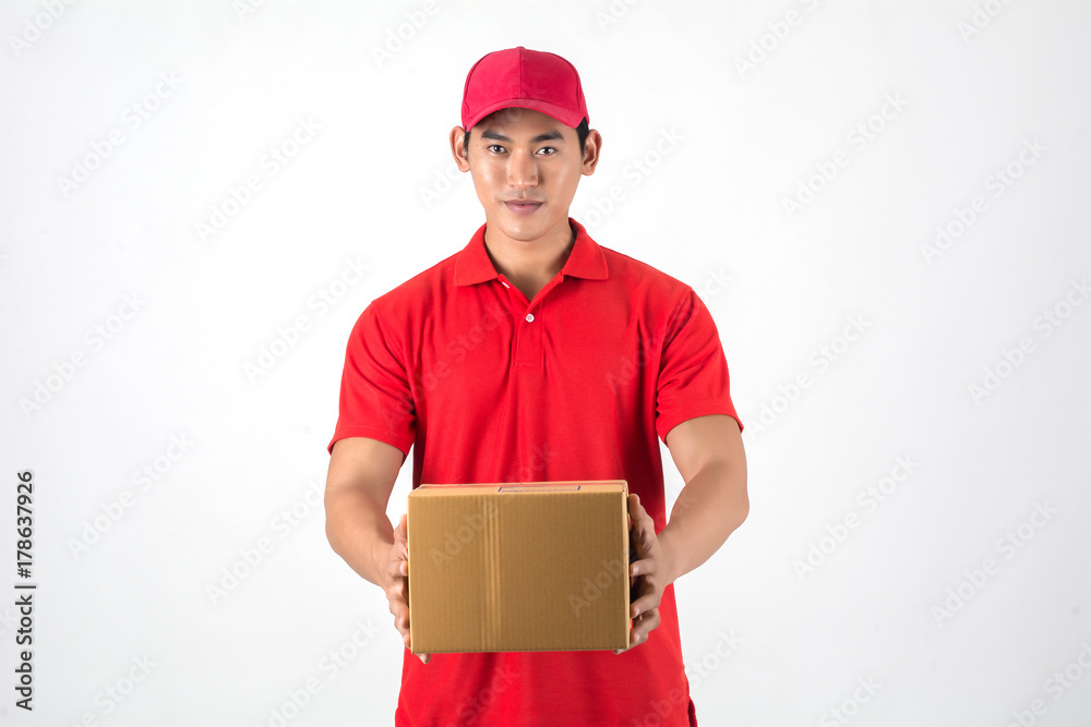 Handsome young delivery man with box isolated on white background. Handsome young delivery man with box isolated on white background.
