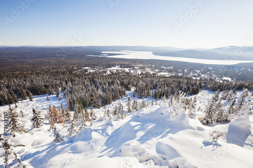 View of lake Zuratkul from Mountain range. Winter landscape.