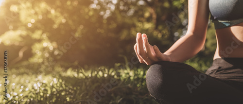 Yoga in the park, outdoor with effect light, health woman, Yoga woman. Concept of healthy lifestyle