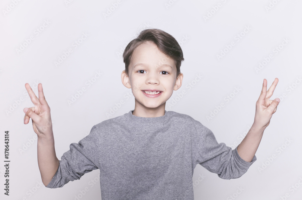 Portrait of young happy smiling brunette boy looking at camera isolated. Portrait of young happy smiling brunette boy looking at camera isolated.