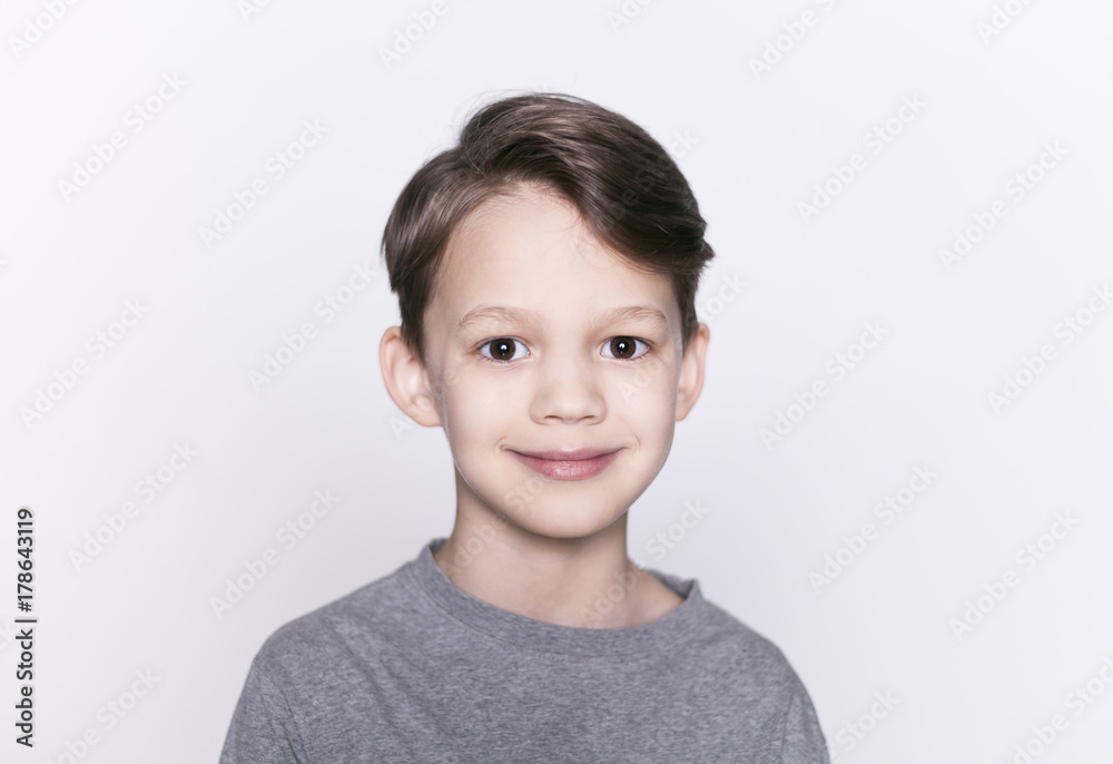 Portrait of young happy smiling brunette boy looking at camera isolated. Portrait of young happy smiling brunette boy looking at camera isolated.