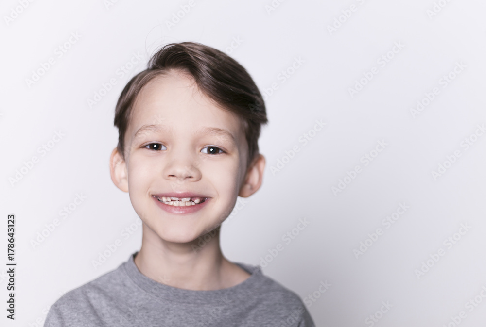 Portrait of young happy smiling brunette boy looking at camera isolated. Portrait of young happy smiling brunette boy looking at camera isolated.