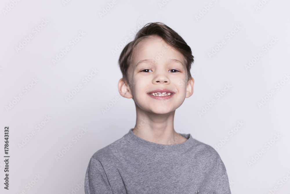 Portrait of young happy smiling brunette boy looking at camera isolated. Portrait of young happy smiling brunette boy looking at camera isolated.