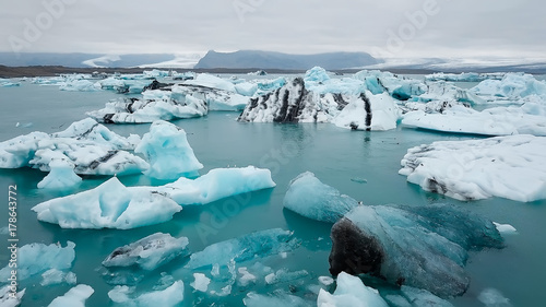 Aerial over icebergs floating in Jokulsarlon Lagoon by the southern coast of Iceland