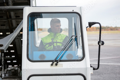 Man Driving Mobile Gangway On Runway