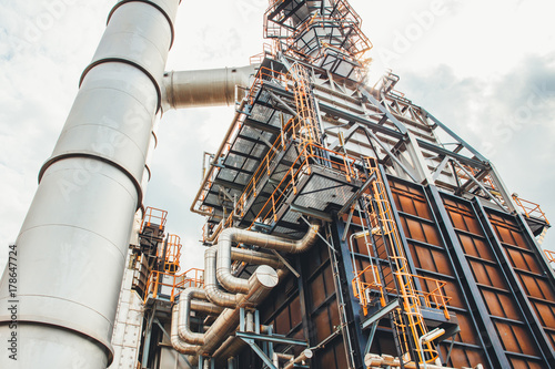 Industrial zone,The equipment of oil refining,Close-up of industrial pipelines of an oil-refinery plant,Detail of oil pipeline with valves in large oil refinery.