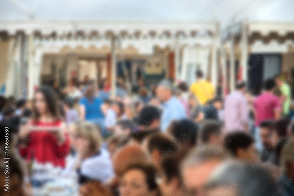 blurred crowd in a food festival, image of people not on focus (the picture is voluntarily defocused for background usage) blurred crowd in a food festival, image of people not on focus (the picture is voluntarily defocused for background usage)