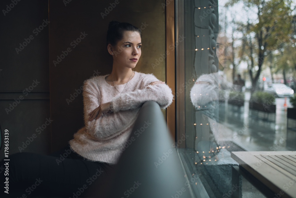 Girl sadly thoughts and looks at window Girl sadly thoughts and looks at window