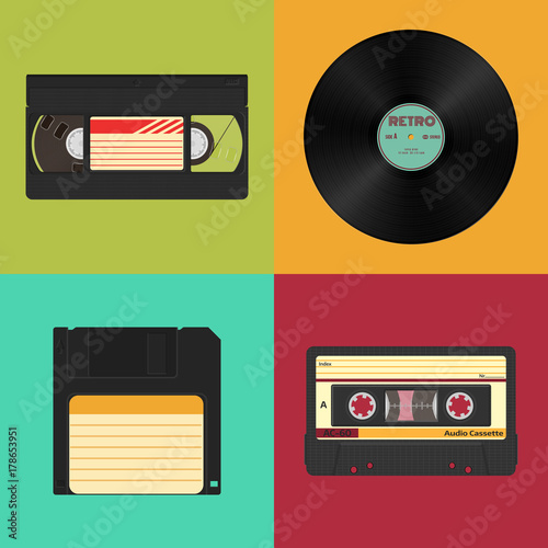 Set of retro audio, video and data storage. Audio, video cassettes, vinyl record and floppy diskette.