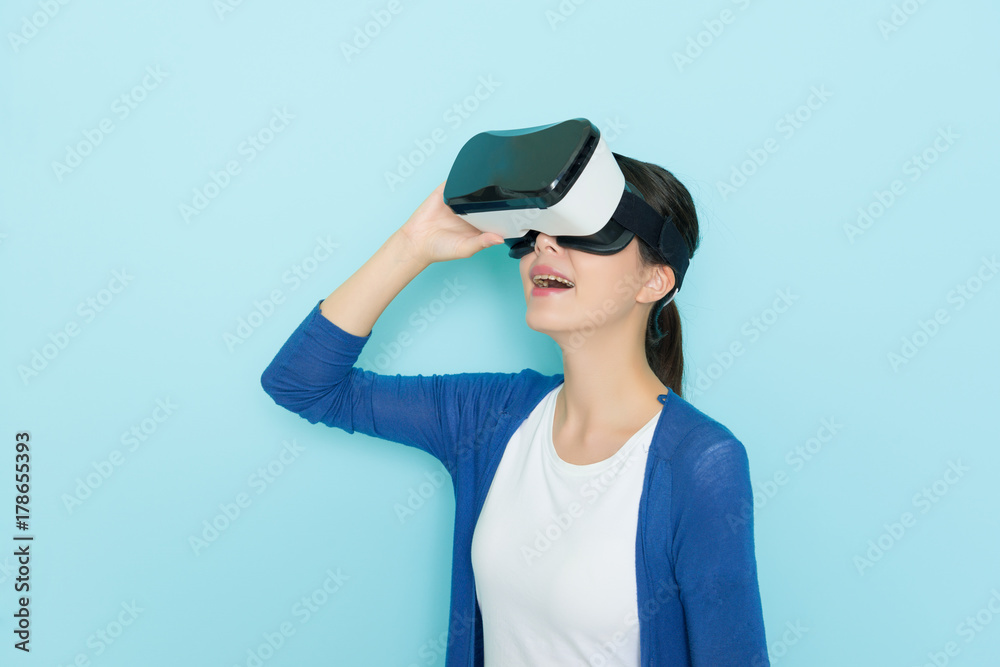 beautiful cheerful girl adjusting VR headset beautiful cheerful girl adjusting VR headset